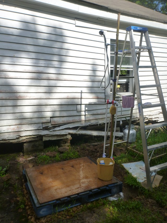 Outdoor shower - with temporary towel rack and clothes holder.