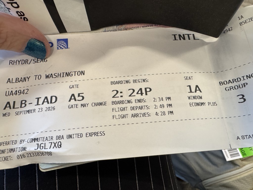 A flight boarding pass for a United Airlines flight from Albany to Washington, showing details such as flight number, gate A5, seat 1A, boarding times, and flight schedule.